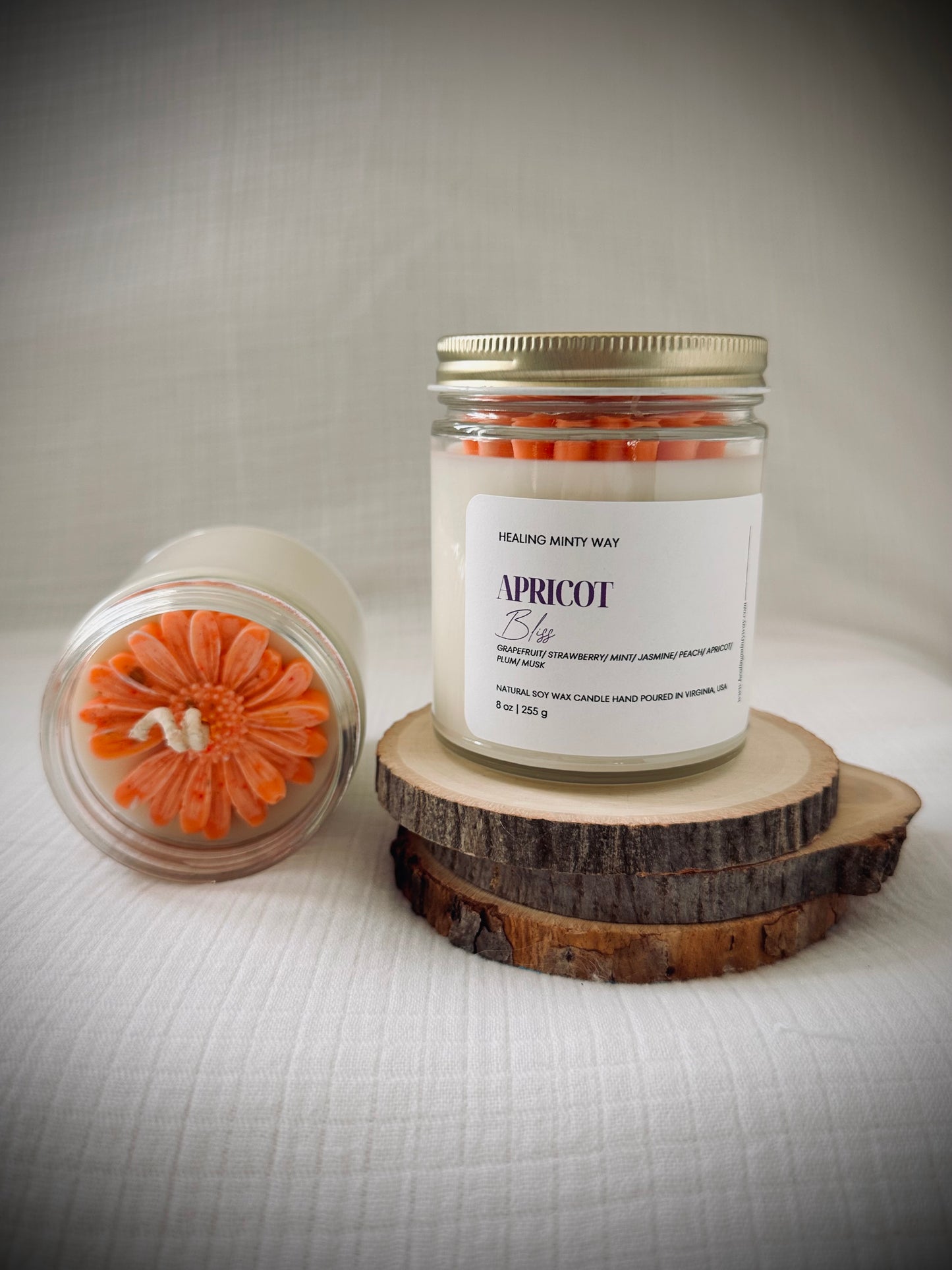 Hand-poured Apricot Bliss Soy Wax Candle with notes of apricot, jasmine, and musk