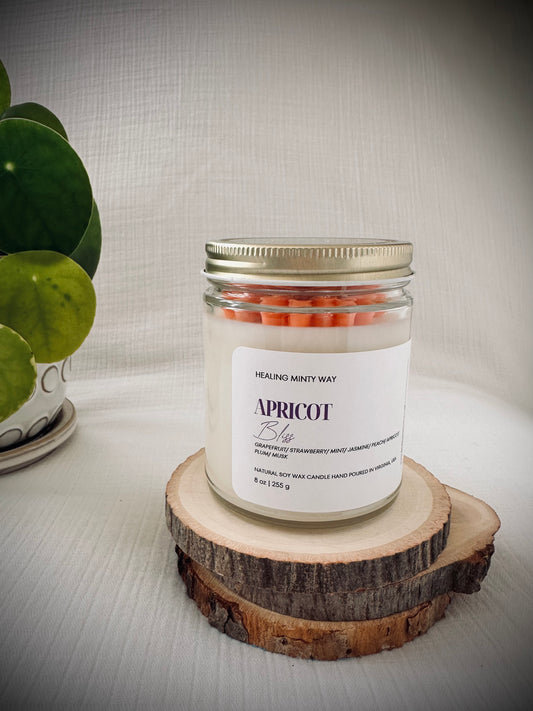 Hand-poured Apricot Bliss Soy Wax Candle with notes of apricot, jasmine, and musk