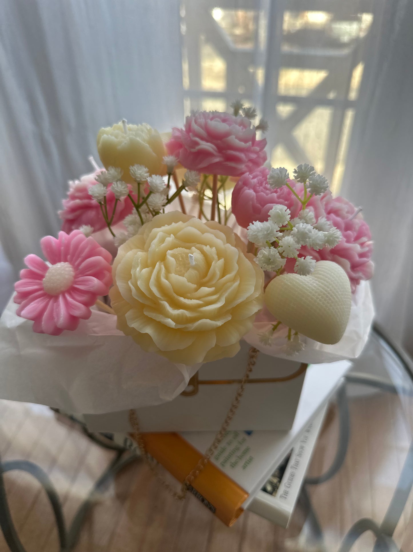 Custom candle flower arrangement featuring handcrafted candles with floral accents, perfect for events and special occasions.