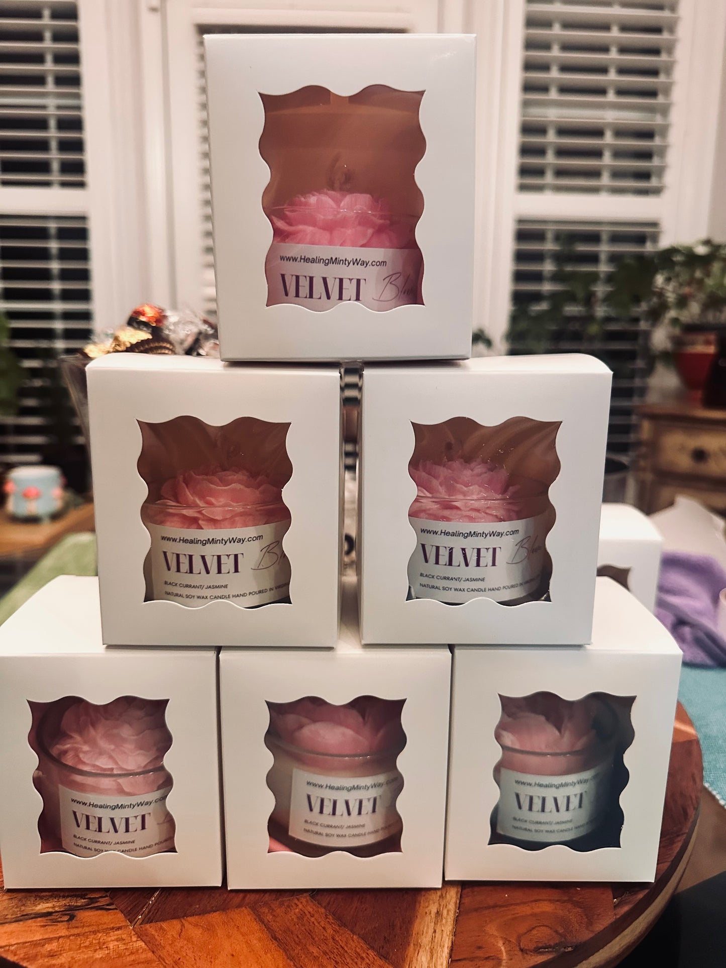 Luxurious candle on display with elegant packaging and soft lighting
